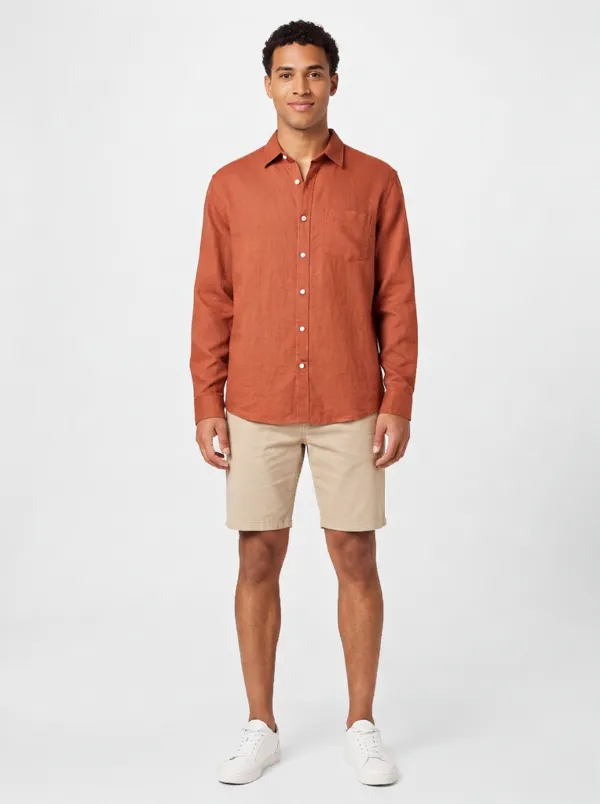 An AI model wearing the rust linen shirt, generated by AbrimaAI
